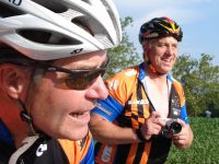 Tour de France winner Greg LeMond snapping pics on charity ride with Pat McCloskey.