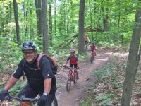 Check the smiles and the kids on the nice smooth single track.
Credit: Pat McCloskey