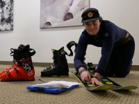 Maura Grady of Ski Butlers adjusts the bindings on Rossignol Soul 7 HD skis, one of the models the company offers. Credit: Jon Nelson